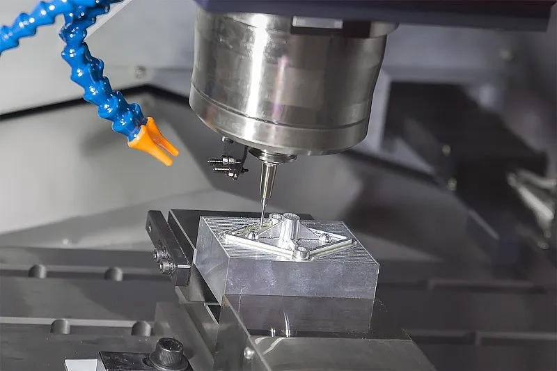 CNC milling operation on metal block