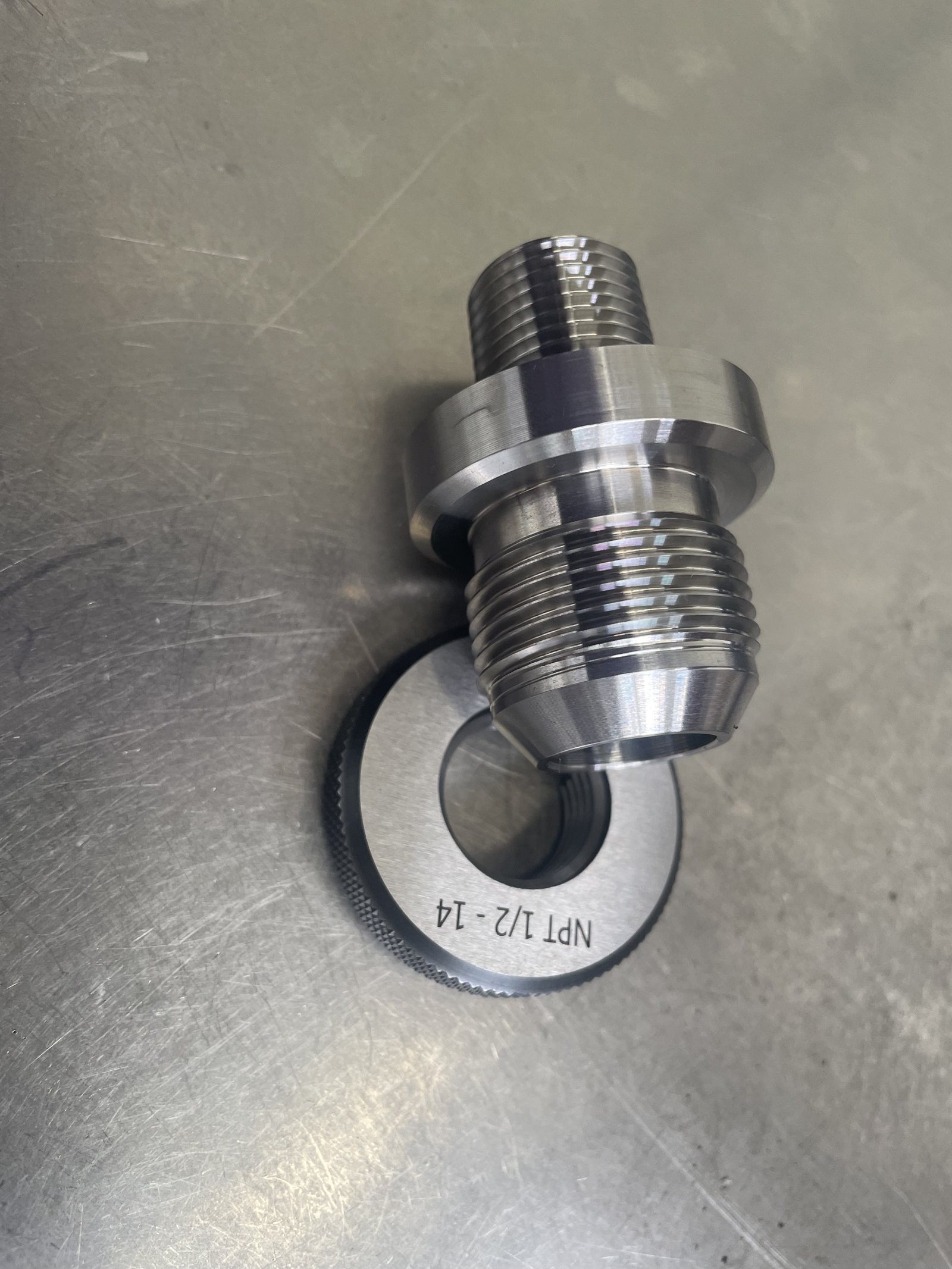 CNC machined threaded connector with thread gauge